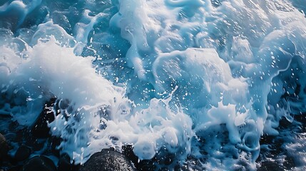 "Majestic Ocean Waves Crashing Against Rugged Rocks, Creating an Abstract Pattern of Dynamic Motion and Natural Beauty in Stunning Coastal Scenery"

