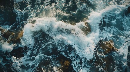 "Majestic Ocean Waves Crashing Against Rugged Rocks, Creating an Abstract Pattern of Dynamic Motion and Natural Beauty in Stunning Coastal Scenery"

