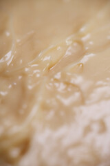 Close up texture of mayonnaise. Mayonnaise is an emulsion of oil, egg yolk and an acid either vinegar or lemon juice
