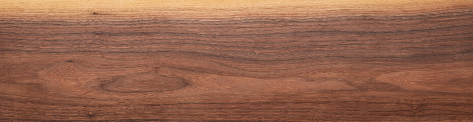 Walnut wood texture background. Walnut plank top. Long plank texture background. Panoramic wood plank texture background. Walnut wood plank natural texture. Panoramic background elements.