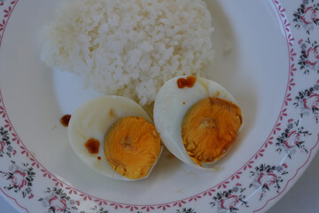 Boiled egg rice with sauce, ready to eat