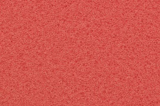 Watermelon pink foam background one color porous sponge packing material.	