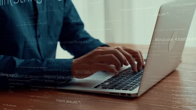 Computer programmer uses capable laptop computer to develop programming code of new software . Computer specialist working on future coding application for software programming development .