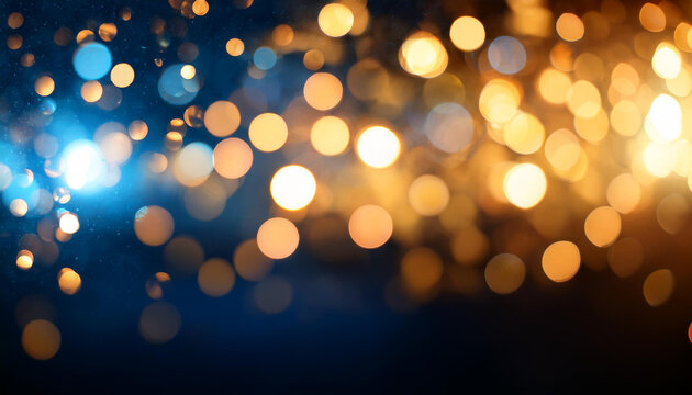 fond lumineux abstrait avec des bokeh dor&eacute;s et bleus dans l'obscurit&eacute;, repr&eacute;sentant la magie et l'illumination effets lumineux. - No&euml;l, f&ecirc;tes de fin d'ann&eacute;e d&eacute;cembre janvier