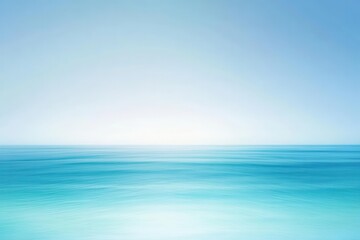 Obraz premium A serene seascape with a gradient of blue hues blending into a clear sky.