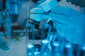 lab, scientist working on scientific equipment in modern laboratory, International team of scientists working together in medical laboratory doing research on chemicals and bacteria