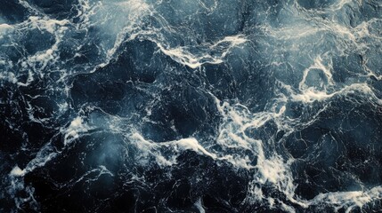 dark marble surface with intricate patterns resembling ocean waves and natural textures for elegant backgrounds and design projects