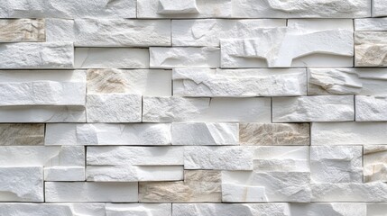 Obraz premium Textured white brick wall surface featuring natural stone material with varying shades and patterns, ideal for backgrounds, interior design, architecture, minimalist aesthetics, home decor.