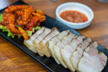 Korean food, steamed pork and vegetables dish called BoSsam. Traditional healthy food in South Korea.
