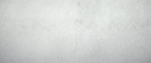 Obraz premium A textured grey and white concrete wall with subtle stains and speckles.