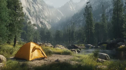 Fotobehang Solo camping tent by a river in a misty mountain valley. © Misdi