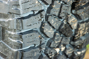 Aggressive tread pattern on an all-terrain tire for a 4x4