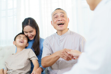 Asian elderly man with family are talking with doctor.