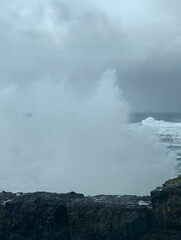 King Tides during Oregon winter are a sight to see. In Depot Bay the water surges all the way across the highway during king tide.