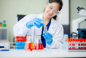 Discover a dedicated scientist conducting laboratory research, using pipettes, microscopes, and lab...
