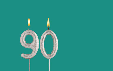 Birthday candle number 90 - Card on a green background.