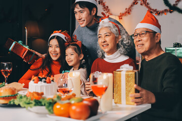 Happy family with gifts celebrating Christmas together
