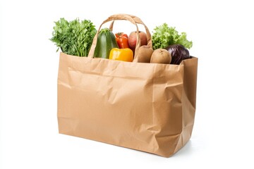 Brown paper grocery bag filled with fresh produce, including zucchini, bell peppers, lettuce, parsley, potatoes, and red cabbage.