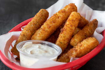 fried zucchini sticks with mayo, detail, shallow depth of field with focus on the middle