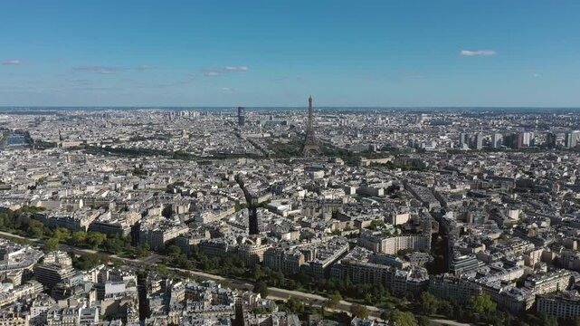 PARIS, FRANCE - OCTOBER 3, 2024: Aerial view of Paris showcasing the Eiffel Tower and expansive city landscape under a clear blue sky
