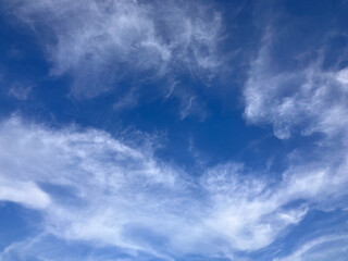 Cloud Artistry: Intricate Patterns in a Peaceful Daytime Sky