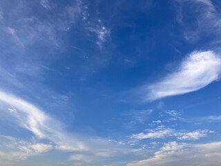 Obraz premium Pristine Blue Atmosphere with Dreamlike White Cloud Swirls Above