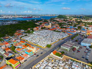 Fototapeta premium Santa Famia church and cemetery aerial view at Otrobanda center in city of Willemstad, Curacao. Historic Willemstad is a UNESCO World Heritage Site. 