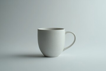 Fototapeta premium Simple white ceramic mug on a white background.