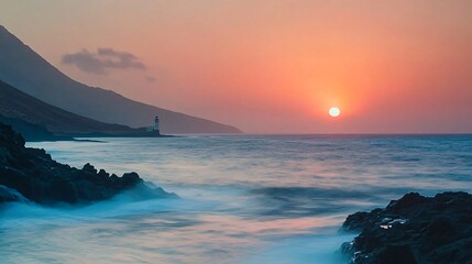 A serene sunset over the ocean, with gentle waves lapping against the rocky shore and a distant lighthouse silhouetted against the colorful sky. - Powered by Adobe