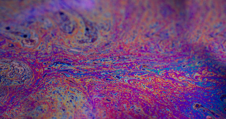 Acrylic emulsion. Bubbles wave. Defocused multicolor purple green liquid oil paint curve acrylic...