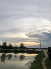 The afternoon atmosphere is approaching evening with a cloudy sunset