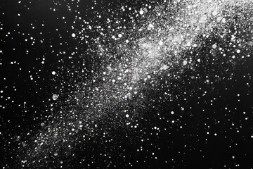 Obraz premium White powder explosion on black background. Ideal for adding a dramatic, energetic feel to designs.