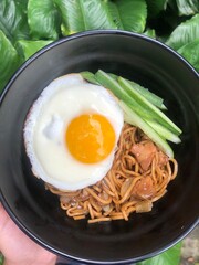 Homemade noodles with beef and sunny side up egg