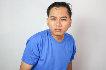 Squinting eyes of a man looking at screen. Poor eyesight, bad vision. Light from laptop computer or phone.