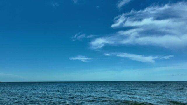 Nature of the beach and sea Summer with sunshine, sandy beaches, clear blue waters sparkling against the blue sky. On an island with good ecology and environment Background for summer vacation concept