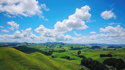Breathtaking scenic view of rolling hills countryside landscape photography nature aerial perspective green grass under blue sky with fluffy clouds
