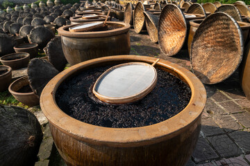 Close-up of the soy sauce jars in the soy sauce workshop.