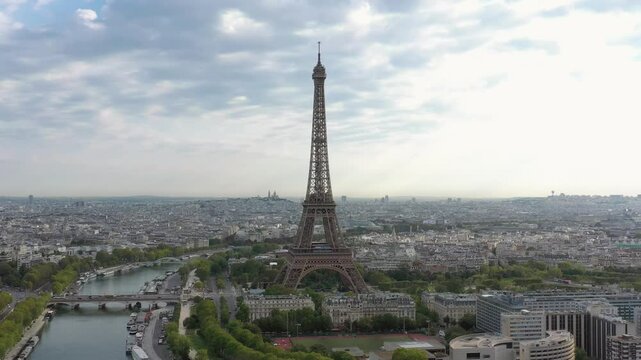 PARIS, FRANCE - OCTOBER 3, 2024: Stunning aerial view of the Eiffel Tower surrounded by a vibrant cityscape and lush greenery