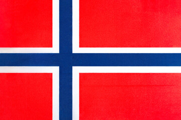 the national flag of Norway on a fabric basis in close-up