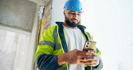 Man, phone and construction worker with texting, reading and contact with info for building...