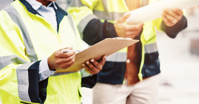 People, clipboard or hands with architect for construction checklist, inspection or planning in city. Closeup, civil engineer or contractors with document for building layout, project or safety check