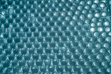 Blue water gel balls. Polymer gel. Silica gel. Balls of hydrogel round shape. Crystal liquid ball with reflection. Water beads
