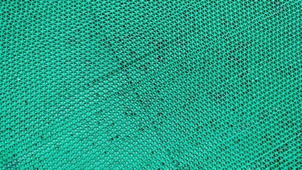 waterproof green rubber mat carpet. Dirty black rubber shoe mat. Top view. Shoe dirt on the mat