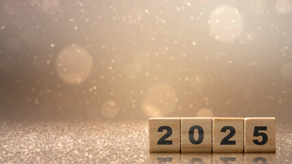 Wooden blocks with number 2025 and abstract bokeh lights background