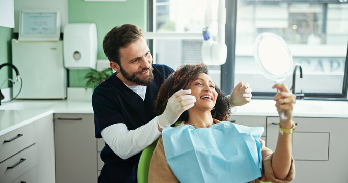 Dentist, smile and woman with mirror to check for consulting, teeth whitening and wellness. Healthcare, dentistry and man with patient for dental hygiene, oral cleaning and medical services in clinic