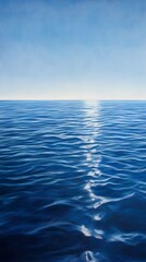 Fototapeta premium A serene ocean scene with gentle waves reflecting sunlight under a clear blue sky.