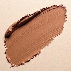A brush stroke of Mocha Mousse color. Background for the text. The color of 2025 is warm brown. 