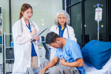 Fototapeta premium Two female doctors examine a patient lying on a hospital bed,discuss the medical chart,administer medicine,and provide encouragement, ensuring compassionate care and fostering the patient's recovery