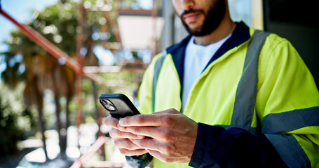 Hands, smartphone and construction site with texting, person or contact with info for building development. Engineer, phone and check with network, architecture and reading on mobile app at property