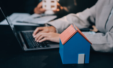 Fototapeta premium Close up Business people or Real Estate agent explain signing agreement for sale house to client. Property, Insurance, Broker concept.